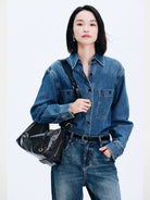 DISSONA Distressed Leather Crescent Hobo Bag in Black - On Female Model