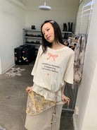 NeverSeez Snake Bow Print T Shirt in White - On Model