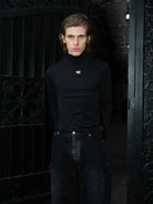 TRIANGLE PROJECT Logo High Neck Long Sleeve Top in Black - On Model