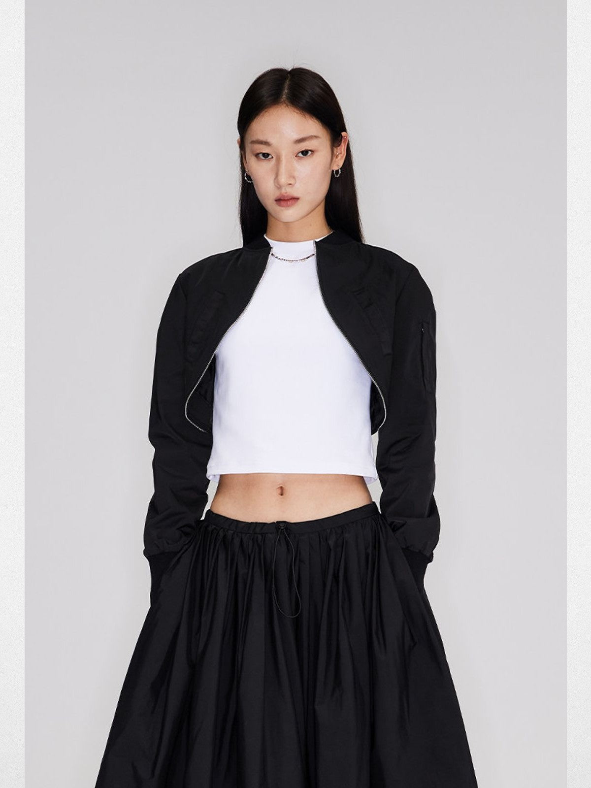 RARELY ALIKE Curved Hem Cropped Bomber in Black - On Model
