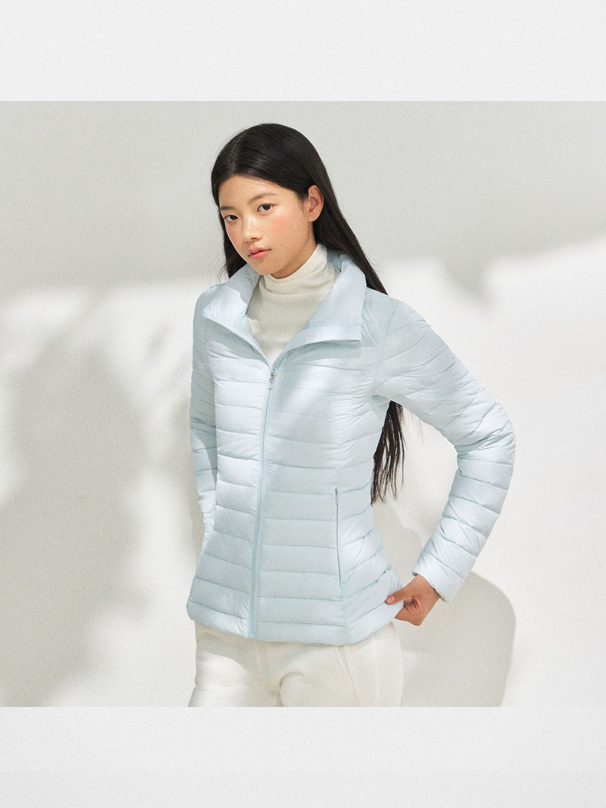 ARISEISM Lightweight Stand Collar Down Puffer in Sky Blue - On Model