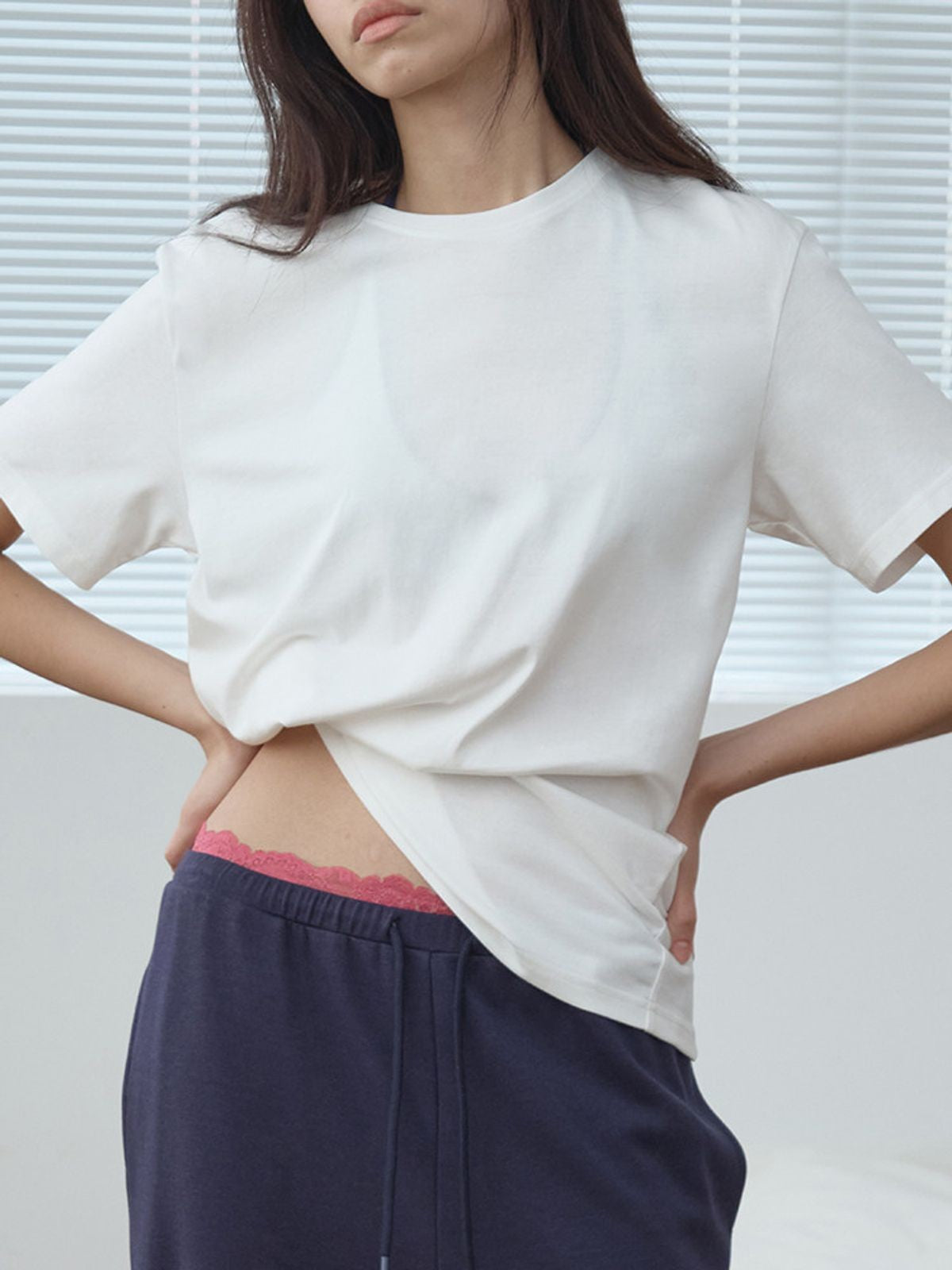 RARELY ALIKE Twisted Hem Cotton Silk Blend Tee in White - On Model