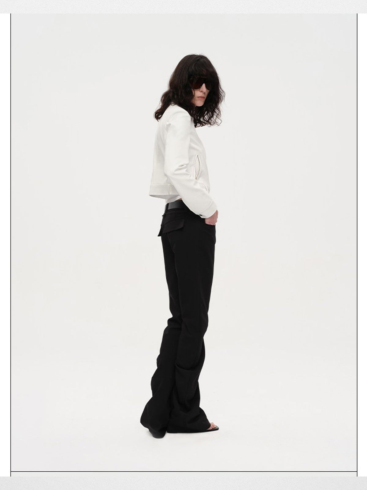 RARELY ALIKE Curved Leg Flared Suit Pants in Black - On Model