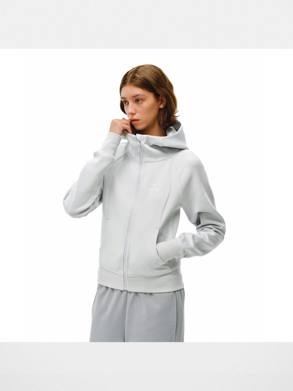 FPA High Collar Zip Up Hoodie in Light Gray - On Model