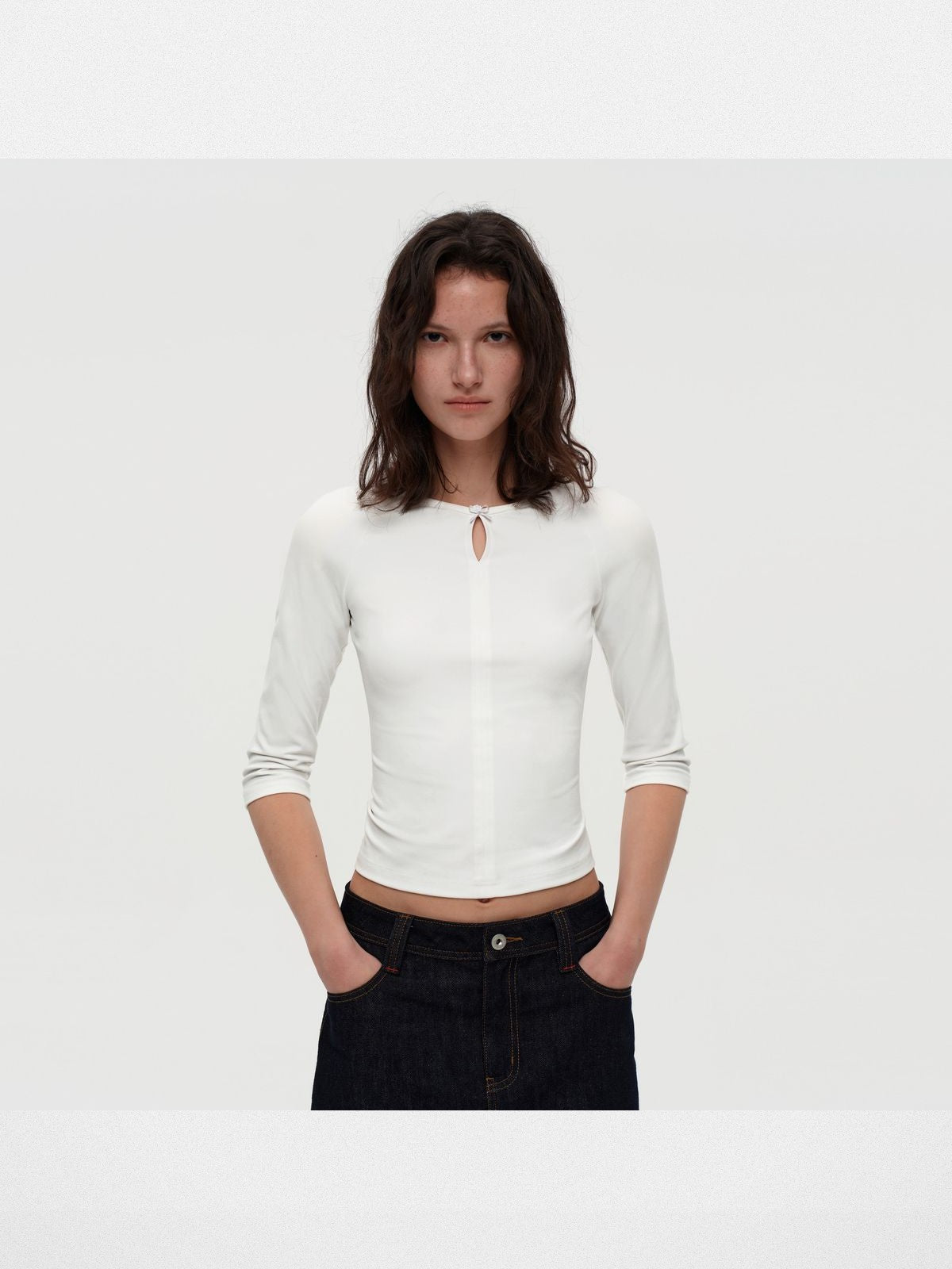 PUKI Lenzing Modal Bow Cutout 3 4 Sleeve Top in White - On Model
