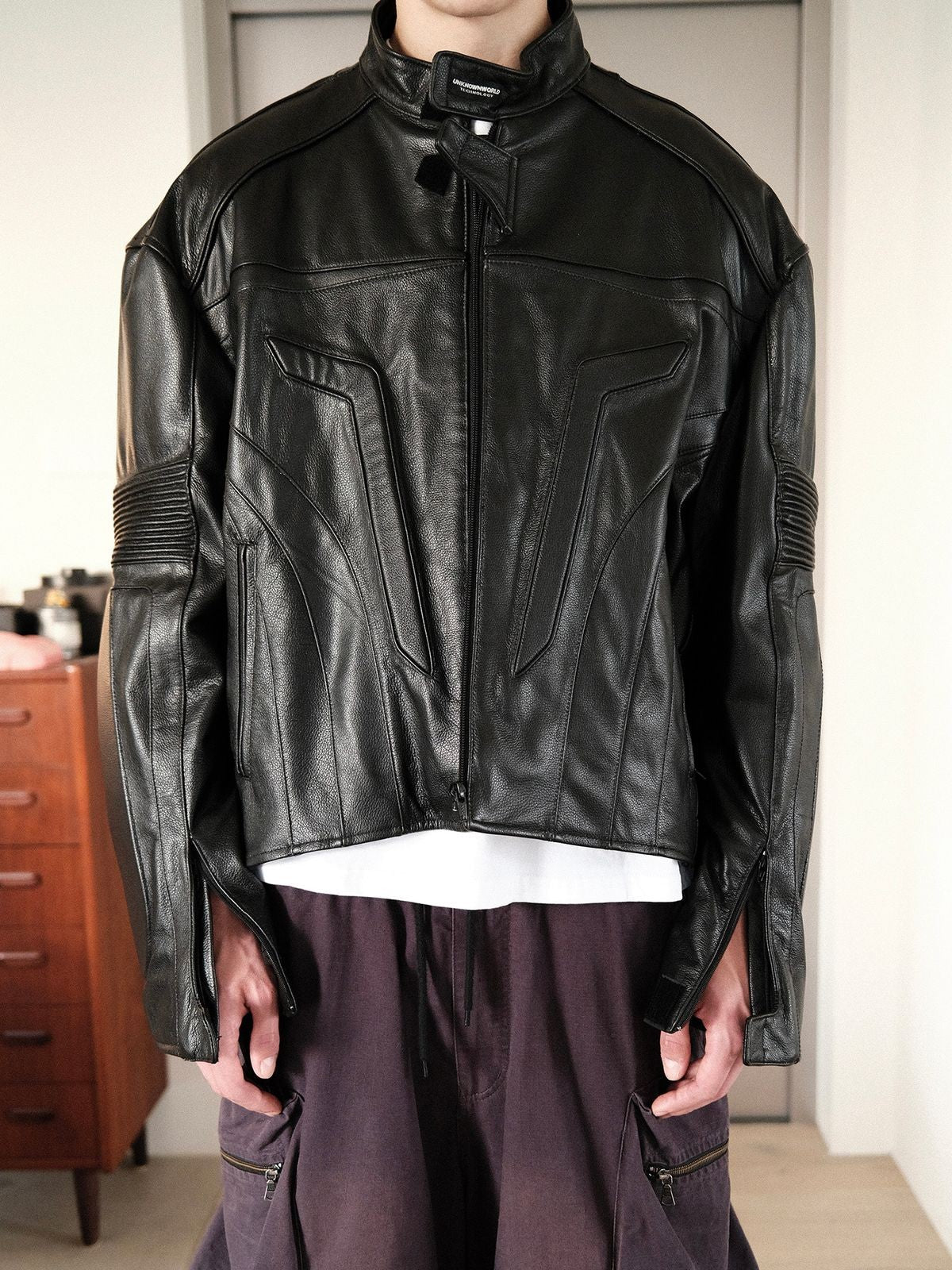 UNKNOWNWORLD Structured Cowhide Biker Jacket in Black - On Model
