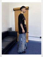 Triangle Project Distressed Dirty Dye Patchwork Jeans in Denim - On Male Model