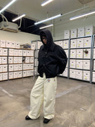 NeverSeez Leather Down Puffer Jacket in Black - On Male Model