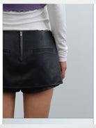 rarely alike Side Zip Faux Leather Mini Skort in Black - On Model