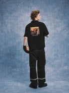 SOD Strip Poker Graphic Cotton Polo in Black - On Model