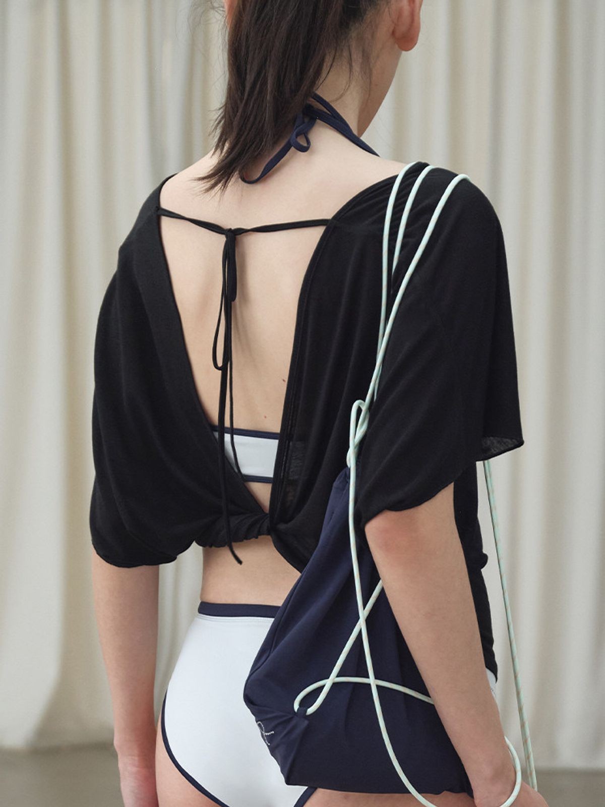 RARELY ALIKE Tie Back Lyocell Batwing Top in Black - On Model