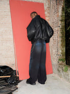 TRIANGLE PROJECT Dirty Wash Spray Detail Jeans in Black - On Model