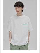 NANS Wilderness Parade Heavyweight T Shirt in White - On Model