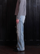 VLABMADE Distressed Sashiko Flare Jeans in Blue - On Male Model