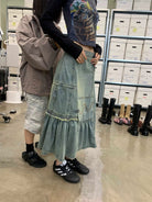 NeverSeez Asymmetric Vintage Wash Denim Skirt in Blue - On Model