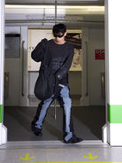 TRIANGLE PROJECT Deconstructed Patchwork Micro Flare Jeans in Black - On Model