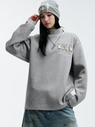 MEDM Leather Patchwork Logo Sweatshirt in Gray - On Female Model