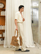 Retro 21 Handmade Raffia Cutout Tote Bag in Khaki - On Male Model