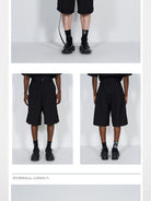 BLINDNOPLAN Dislocated Stripe Tailored Shorts in Black - On Model