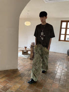 NeverSeez Garment Dyed Puppet Print Tee in Gray - On Male Model