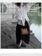 VINEY Split Leather Bucket Bag in Brown - On Female Model