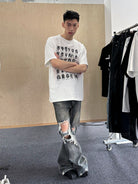 TRIANGLE PROJECT Distressed Dirty Wash Micro Flare Jeans in Denim - On Model