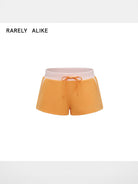 RARELY ALIKE Color Block Sweat Shorts in Orange