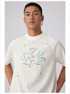 Simple Project Studded Script Logo T Shirt in White - On Male Model