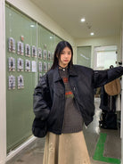 NeverSeez Leather Down Puffer Jacket in Black - On Female Model