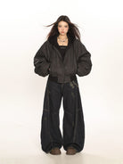 BIGGOLD STUDIO Layered Hooded Faux Leather Bomber in Gray - On Model #color_gray