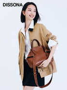 DISSONA Vegetable Tanned Leather Folded Tote in Brown - On Female Model