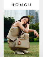 HONGU Leather Chain Strap Shoulder Bag in Beige - On Female Model