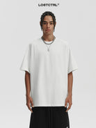 LOSTCTRL Loose Fit Cotton Crew Neck T Shirt in White - On Model