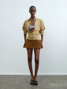 RARELY ALIKE Side Zip Faux Leather Skort in Brown - On Model