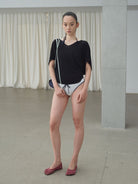 RARELY ALIKE Tie Back Lyocell Batwing Top in Black - On Model