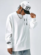 MEDM Embroidered Logo Long Sleeve Tee in White - On Male Model