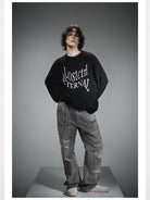 LOSTCTRL Distressed Logo Cotton Sweater in Black - On Male Model