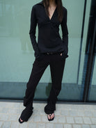 RARELY ALIKE Curved Leg Flared Suit Pants in Black - On Model