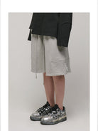 LOSTCTRL Raw Edge Embroidered Cotton Shorts in Gray - On Model