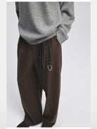 NANS Double Pleated Wool Blend Trousers in Brown - On Model