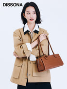 DISSONA Vegetable Tanned Leather Baguette Bag in Brown - On Female Model