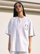 MEDM Oversized Logo Print T Shirt in White - On Female Model