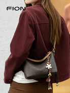 FION Monogram Coated Canvas Hobo Bag in Brown - On Female Model