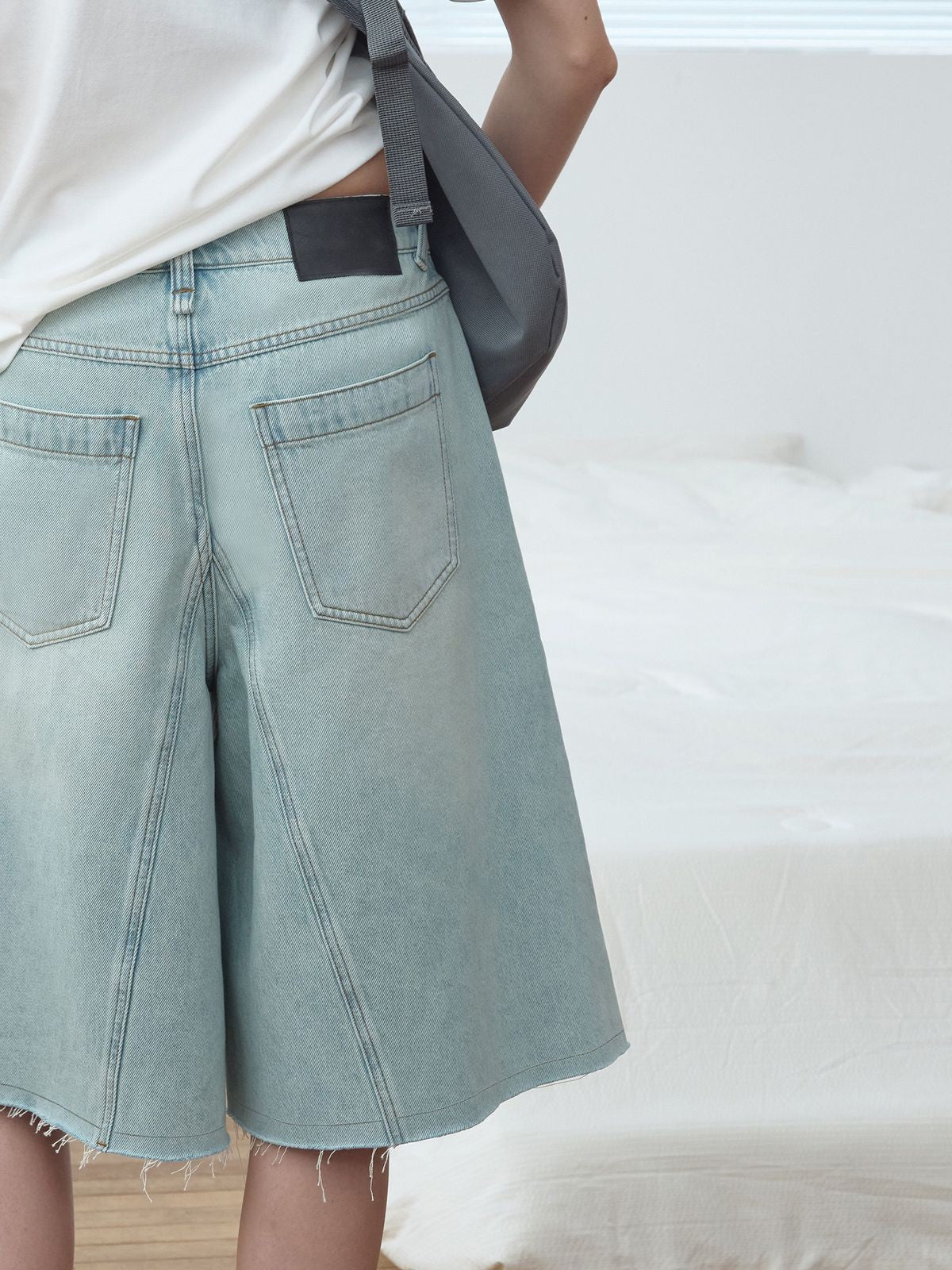 RARELY ALIKE Raw Edge A Line Cropped Jeans in Light Blue - On Model