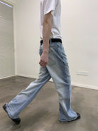 NeverSeez Distressed Washed Micro Flare Jeans in Blue - On Model