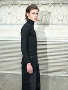 TRIANGLE PROJECT Logo High Neck Long Sleeve Top in Black - On Model