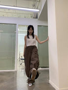 NeverSeez Accordion Pocket Wide Leg Cargo Pants in Brown - On Female Model