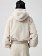 Simple Project Detachable Hood Faux Fur Jacket in Cream - On Model