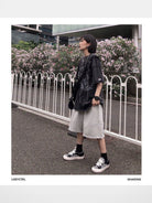 LOSTCTRL Raw Edge Embroidered Cotton Shorts in Gray - Lifestyle