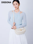 DISSONA Leather Crossbody Saddle Bag in Cream - On Female Model